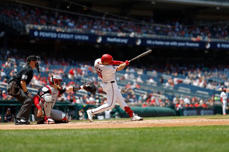 May 22, 2024; Washington, District of Columbia, USA; Washington Nationals catcher Riley Adams (15) singles against the Minnesota Twins during the third inning at Nationals Park. Mandatory Credit: Geoff Burke-USA TODAY Sports