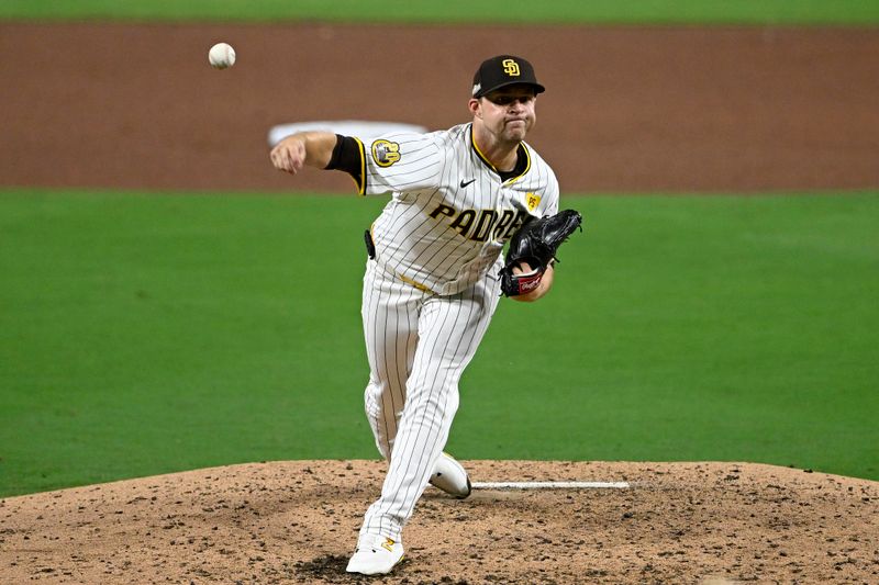 Oct 1, 2024; San Diego, California, USA; San Diego Padres pitcher Michael King (34) throws a pitch against the Atlanta Braves during the fifth inning in game one of the Wildcard round for the 2024 MLB Playoffs at Petco Park. Mandatory Credit: Denis Poroy-Imagn Images