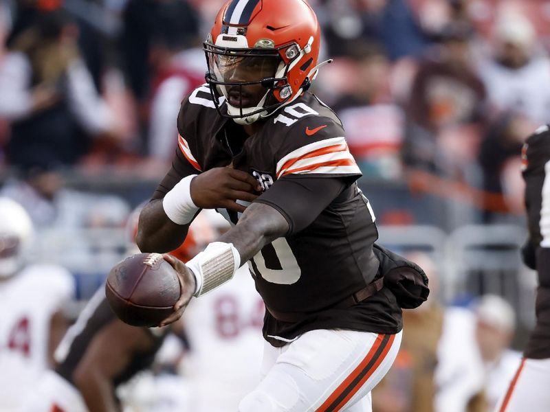 Cleveland Browns quarterback PJ Walker (10) looks to hand off the ball during an NFL football game against the Arizona Cardinals, Sunday, Nov. 5, 2023, in Cleveland. (AP Photo/Kirk Irwin)