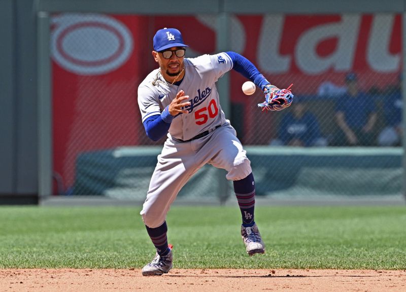 Jul 2, 2023; Kansas City, Missouri, USA;  Los Angeles Dodgers shortstop Mookie Betts (50) mis-plays a ground ball in the sixth inning against the Kansas City Royals at Kauffman Stadium. Mandatory Credit: Peter Aiken-USA TODAY Sports