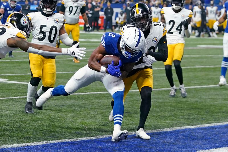 Indianapolis Colts wide receiver D.J. Montgomery (2) scores a touchdown with Pittsburgh Steelers cornerback Patrick Peterson (20) defending during the first half of an NFL football game in Indianapolis on Saturday, Dec. 16, 2023. (AP Photo/Darron Cummings)