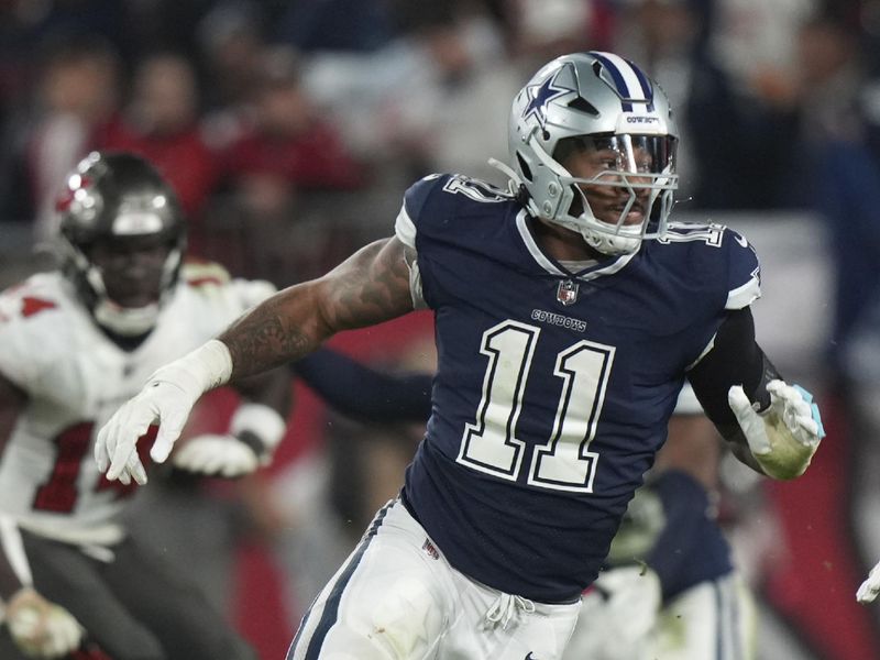 Dallas Cowboys linebacker Micah Parsons (11) blitzes the passer during an NFL wild-card football game against the Tampa Bay Buccaneers, Monday, Jan. 16, 2023, in Tampa, Fla. (AP Photo/Peter Joneleit)