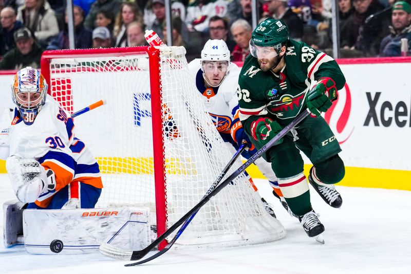 Jan 15, 2024; Saint Paul, Minnesota, USA; New York Islanders goaltender Ilya Sorokin (30) makes a save on Minnesota Wild right wing Ryan Hartman (38) during the second period at Xcel Energy Center. Mandatory Credit: Brace Hemmelgarn-USA TODAY Sports