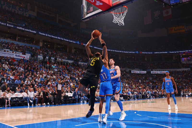 OKLAHOMA CITY, OK - MARCH 20:  Talen Horton-Tucker #5 of the Utah Jazz shoots the ball during the game against the Oklahoma City Thunder on March 20, 2024 at Paycom Arena in Oklahoma City, Oklahoma. NOTE TO USER: User expressly acknowledges and agrees that, by downloading and or using this photograph, User is consenting to the terms and conditions of the Getty Images License Agreement. Mandatory Copyright Notice: Copyright 2024 NBAE (Photo by Zach Beeker/NBAE via Getty Images)