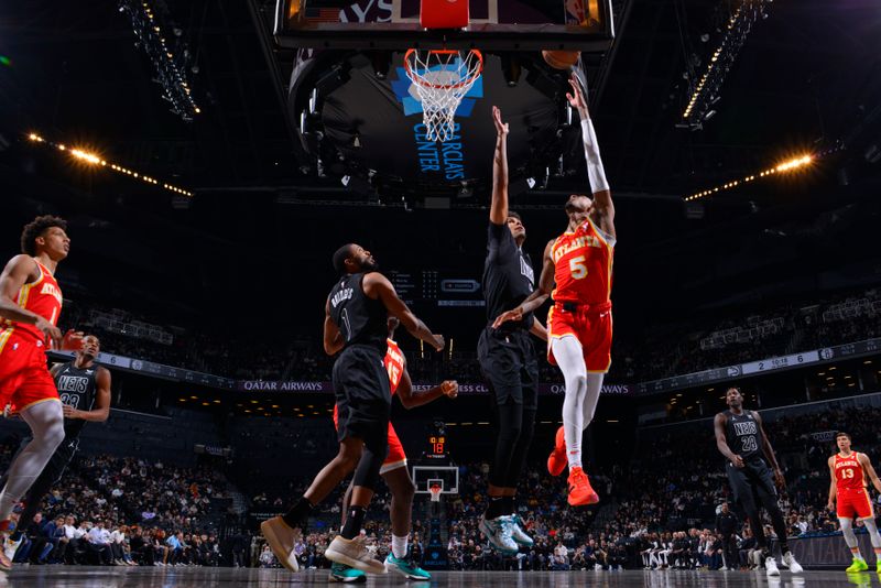 BROOKLYN, NY - FEBRUARY 29: Dejounte Murray #5 of the Atlanta Hawks drives to the basket during the game against the Brooklyn Nets on February 29, 2024 at Barclays Center in Brooklyn, New York. NOTE TO USER: User expressly acknowledges and agrees that, by downloading and or using this Photograph, user is consenting to the terms and conditions of the Getty Images License Agreement. Mandatory Copyright Notice: Copyright 2024 NBAE (Photo by Jesse D. Garrabrant/NBAE via Getty Images)