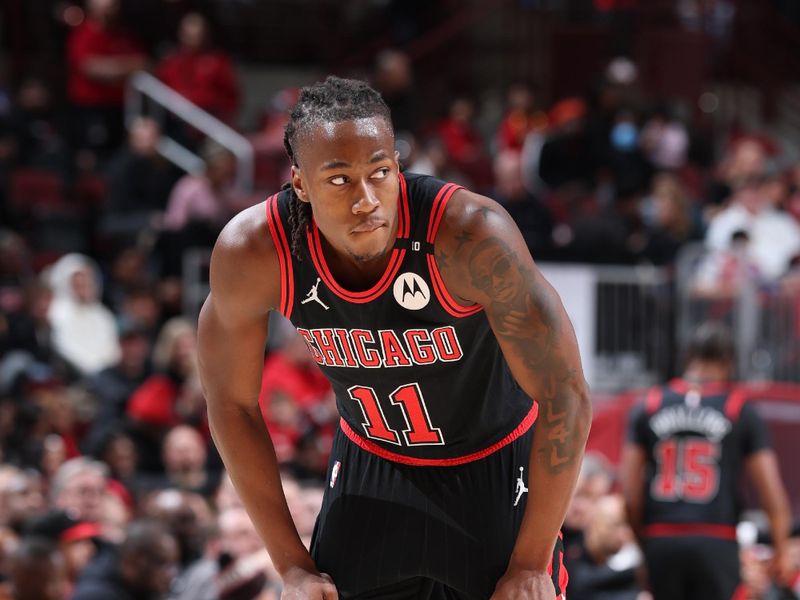 CHICAGO, IL - DECEMBER 13: Ayo Dosunmu #11 of the Chicago Bulls looks on during the game against the Charlotte Hornets on December 13, 2024 at United Center in Chicago, Illinois. NOTE TO USER: User expressly acknowledges and agrees that, by downloading and or using this photograph, User is consenting to the terms and conditions of the Getty Images License Agreement. Mandatory Copyright Notice: Copyright 2024 NBAE (Photo by Jeff Haynes/NBAE via Getty Images)