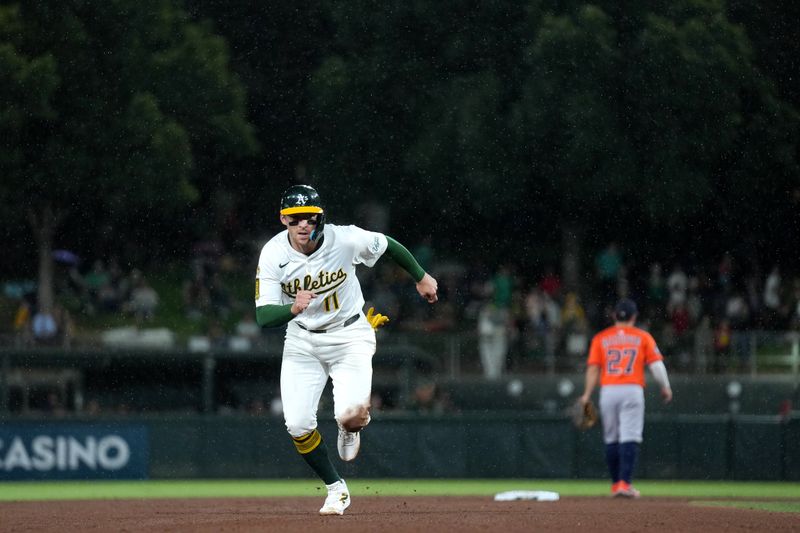 Sep 24, 2025; West Sacramento, California, USA; Athletics third baseman Brett Harris (11) runs toward third base against the Houston Astros in the fifth inning at Sutter Health Park. Mandatory Credit: Cary Edmondson-Imagn Images
