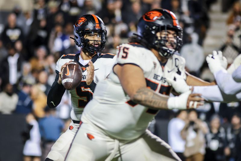 Nov 4, 2023; Boulder, Colorado, USA; Oregon State Beavers quarterback DJ Uiagalelei (5) drops back for a pass against the Colorado Buffaloes at Folsom Field. Mandatory Credit: Chet Strange-USA TODAY Sports