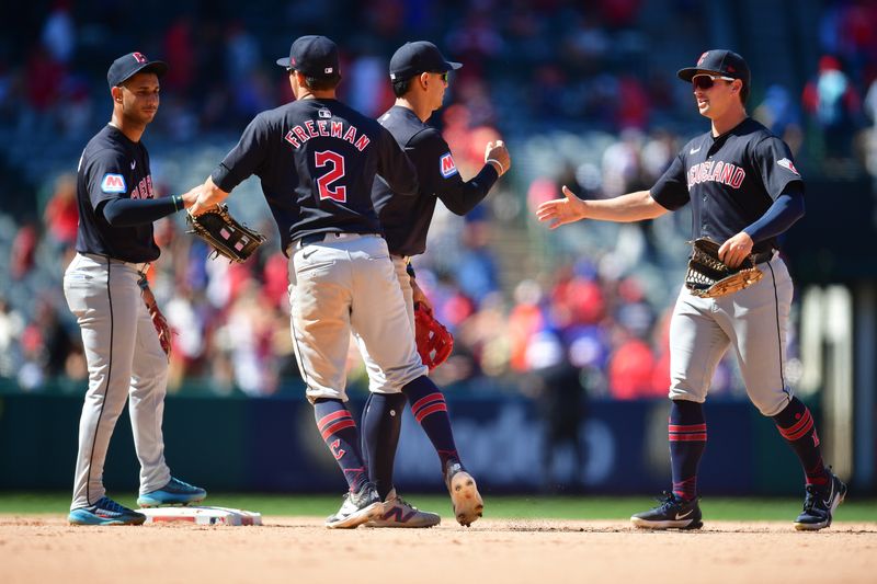 May 26, 2024; Anaheim, California, USA; Cleveland Guardians second base Andres Gimenez (0) outfielder Tyler Freeman (2) celebrate the victory against the Los Angeles Angels at Angel Stadium. Mandatory Credit: Gary A. Vasquez-USA TODAY Sports