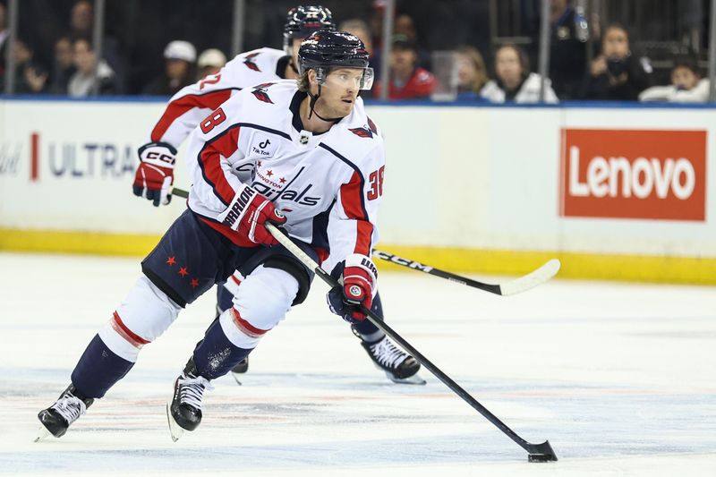 Oct 12, 2025; New York, New York, USA;  Washington Capitals defenseman Rasmus Sandin (38) controls the puck in the third period against the New York Rangers at Madison Square Garden. Mandatory Credit: Wendell Cruz-Imagn Images