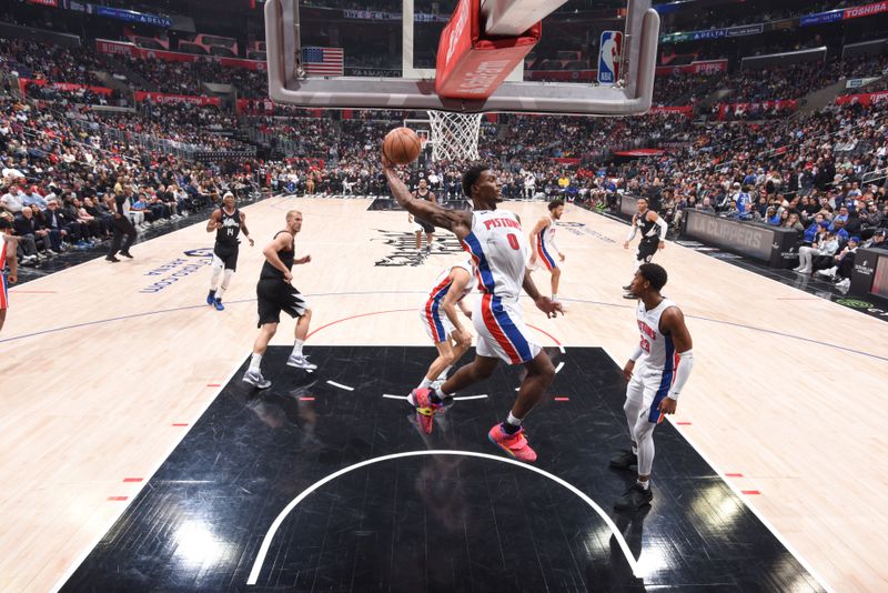 LOS ANGELES, CA - FEBRUARY 10: Jalen Duren #0 of the Detroit Pistons grabs the rebound during the game on February 10, 2024 at Crypto.Com Arena in Los Angeles, California. NOTE TO USER: User expressly acknowledges and agrees that, by downloading and/or using this Photograph, user is consenting to the terms and conditions of the Getty Images License Agreement. Mandatory Copyright Notice: Copyright 2024 NBAE (Photo by Adam Pantozzi/NBAE via Getty Images)