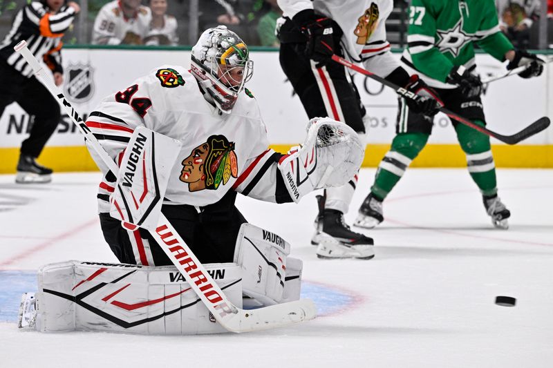 Oct 26, 2024; Dallas, Texas, USA; Chicago Blackhawks goaltender Petr Mrazek (34) stops a shot by the Dallas Stars during the second period at the American Airlines Center. Mandatory Credit: Jerome Miron-Imagn Images