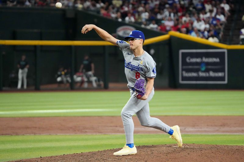 Sep 1, 2024; Phoenix, Arizona, USA; Los Angeles Dodgers third base Enrique Hernández (8) pitches against the Arizona Diamondbacks during the eighth inning at Chase Field. Mandatory Credit: Joe Camporeale-USA TODAY Sports