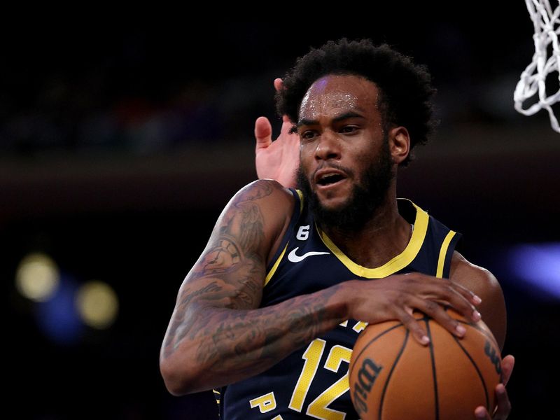 NEW YORK, NEW YORK - APRIL 09:  Oshae Brissett #12 of the Indiana Pacers grabs the rebound in the fourth quarter against the New York Knicks at Madison Square Garden on April 09, 2023 in New York City. NOTE TO USER: User expressly acknowledges and agrees that, by downloading and or using this photograph, User is consenting to the terms and conditions of the Getty Images License Agreement. (Photo by Elsa/Getty Images)