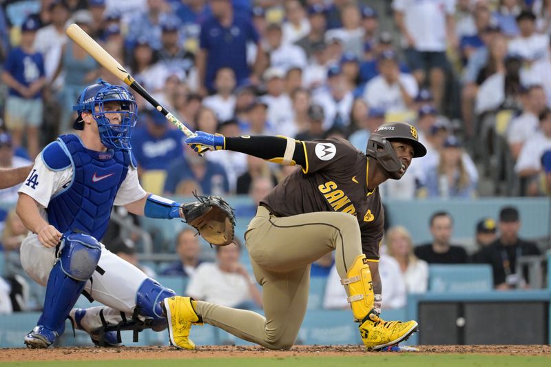 Oct 11, 2024; Los Angeles, California, USA; San Diego Padres outfielder Jurickson Profar (10) reacts at bat in the fourth inning against the Los Angeles Dodgers during game five of the NLDS for the 2024 MLB Playoffs at Dodger Stadium. Mandatory Credit: Jayne Kamin-Oncea-Imagn Images