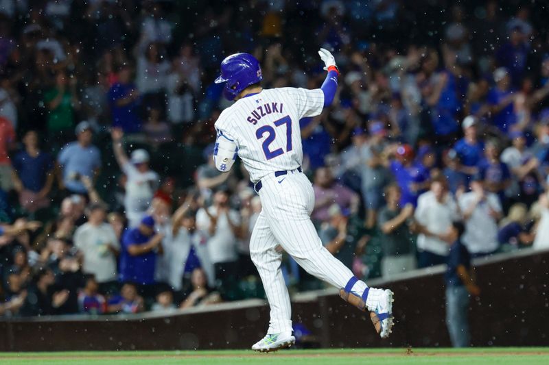 Aug 1, 2024; Chicago, Illinois, USA; Chicago Cubs outfielder Seiya Suzuki (27) rounds the bases after hitting a solo home run against the St. Louis Cardinals during the sixth inning at Wrigley Field. Mandatory Credit: Kamil Krzaczynski-USA TODAY Sports