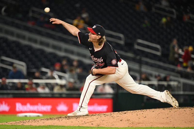 Apr 3, 2024; Washington, District of Columbia, USA; Washington Nationals relief pitcher Hunter Harvey (73) pitches against the Pittsburgh Pirates during the seventh inning at Nationals Park. Mandatory Credit: Rafael Suanes-USA TODAY Sports