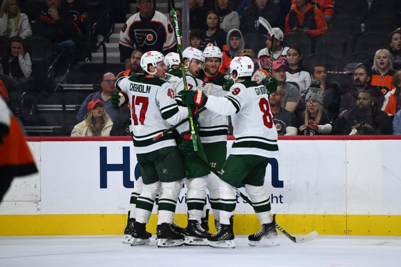 Oct 26, 2024; Philadelphia, Pennsylvania, USA; Minnesota Wild left wing Marcus Foligno (17) celebrates with teammates after scoring a goal against the Philadelphia Flyers in the second period at Wells Fargo Center. Mandatory Credit: Kyle Ross-Imagn Images