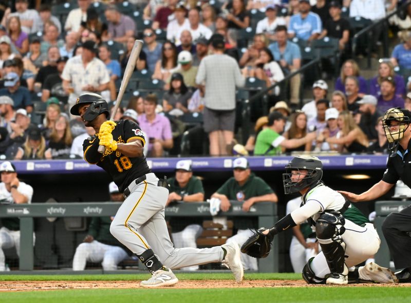 Jun 15, 2024; Denver, Colorado, USA; Pittsburgh Pirates outfielder Michael A. Taylor (18) hits a triple in the fifth inning against the Colorado Rockies at Coors Field. Mandatory Credit: John Leyba-USA TODAY Sports