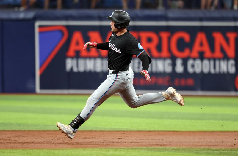 Jul 30, 2024; St. Petersburg, Florida, USA; Miami Marlins catcher Nick Fortes (4) doubles against the Tampa Bay Rays during the second inning at Tropicana Field. Mandatory Credit: Kim Klement Neitzel-USA TODAY Sports