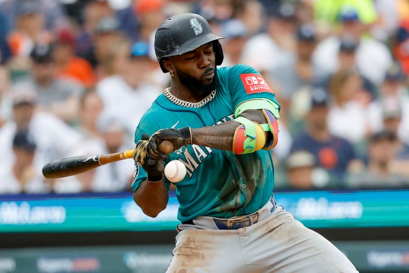 Jul 12, 2025; Detroit, Michigan, USA; Seattle Mariners outfielder Randy Arozarena (56) is hit by a pitch in the third inning against the Detroit Tigers at Comerica Park. Mandatory Credit: Rick Osentoski-Imagn Images