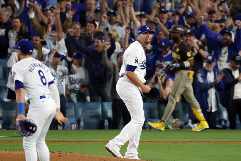 Oct 11, 2024; Los Angeles, California, USA; Los Angeles Dodgers pitcher Blake Treinen (49) celebrates after defeating the San Diego Padres during game five of the NLDS for the 2024 MLB Playoffs at Dodger Stadium. Mandatory Credit: Kiyoshi Mio-Imagn Images