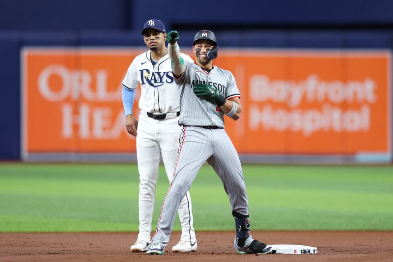 Sep 2, 2024; St. Petersburg, Florida, USA; Minnesota Twins designated hitter Royce Lewis (23) reacts after hitting a rbi double against the Tampa Bay Rays in the first inning at Tropicana Field. Mandatory Credit: Nathan Ray Seebeck-USA TODAY Sports