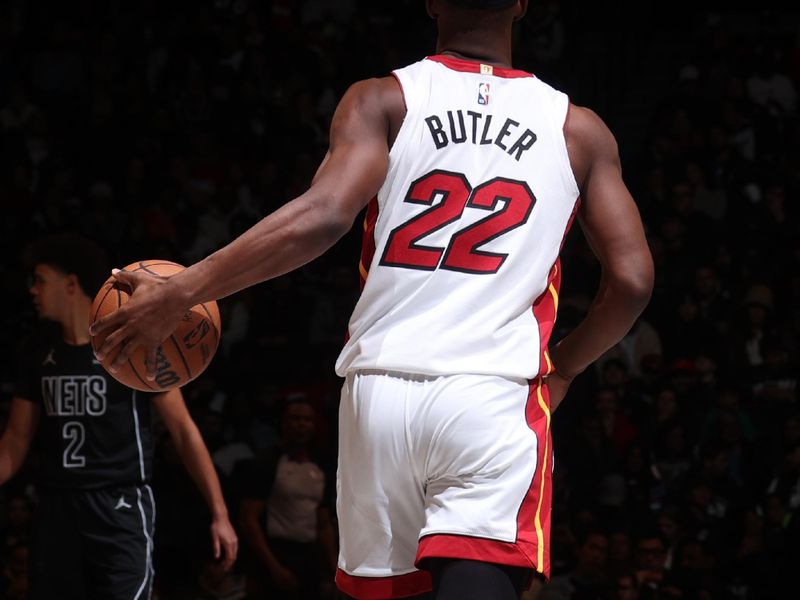 BROOKLYN, NY - JANUARY 15: Jimmy Butler #22 of the Miami Heat dribbles the ball during the game against the Brooklyn Nets on January 15, 2024 at Barclays Center in Brooklyn, New York. NOTE TO USER: User expressly acknowledges and agrees that, by downloading and or using this Photograph, user is consenting to the terms and conditions of the Getty Images License Agreement. Mandatory Copyright Notice: Copyright 2024 NBAE (Photo by Nathaniel S. Butler/NBAE via Getty Images)