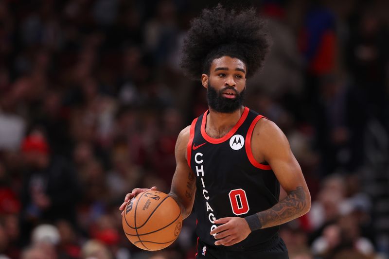 CHICAGO, ILLINOIS - JANUARY 30: Coby White #0 of the Chicago Bulls dribbles up the court against the Toronto Raptors during the first half at the United Center on January 30, 2024 in Chicago, Illinois. NOTE TO USER: User expressly acknowledges and agrees that, by downloading and or using this photograph, User is consenting to the terms and conditions of the Getty Images License Agreement.  (Photo by Michael Reaves/Getty Images)