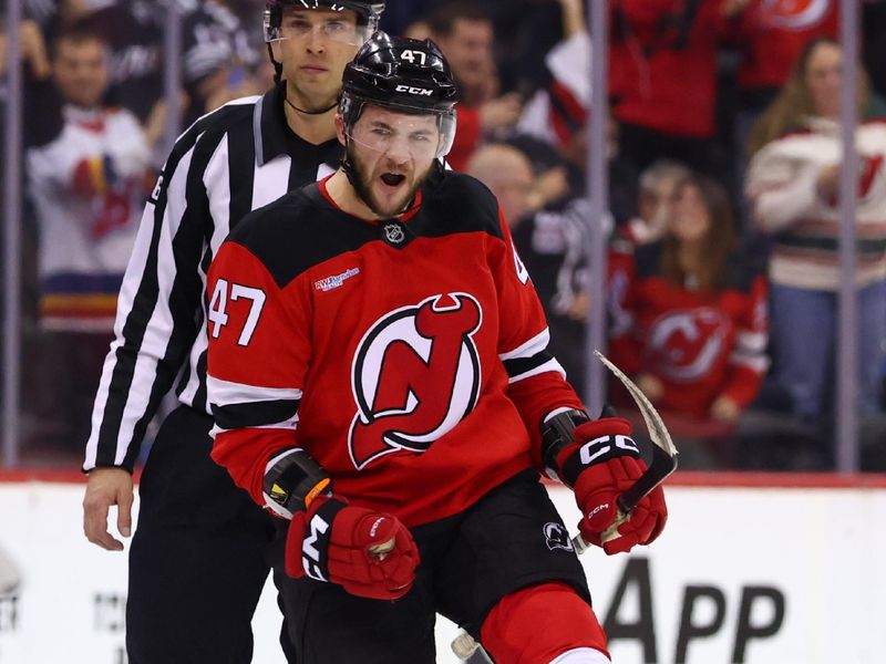 Jan 14, 2025; Newark, New Jersey, USA; New Jersey Devils center Paul Cotter (47) celebrates his shootout goal against the Florida Panthers at Prudential Center. Mandatory Credit: Ed Mulholland-Imagn Images