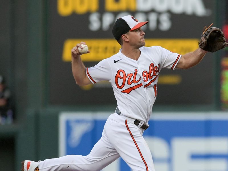 Jul 29, 2023; Baltimore, Maryland, USA;  Baltimore Orioles second baseman Adam Frazier (12) leaps as New York Yankees center fielder Isiah Kiner-Falefa (12) slides into second base during the second inning at Oriole Park at Camden Yards. Mandatory Credit: Tommy Gilligan-USA TODAY Sports