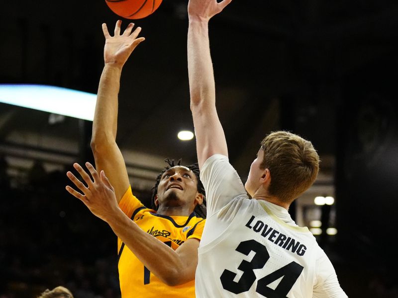 Feb 2, 2023; Boulder, Colorado, USA; California Golden Bears forward Grant Newell (14) shoots over Colorado Buffaloes guard Nique Clifford (32) in the second half at the CU Events Center. Mandatory Credit: Ron Chenoy-USA TODAY Sports