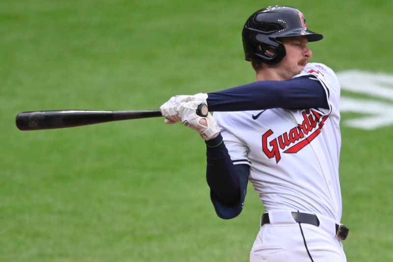 May 6, 2024; Cleveland, Ohio, USA; Cleveland Guardians designated hitter Kyle Manzardo (9) swings during his first MLB at-bat in the second inning against the Detroit Tigers at Progressive Field. Mandatory Credit: David Richard-USA TODAY Sports