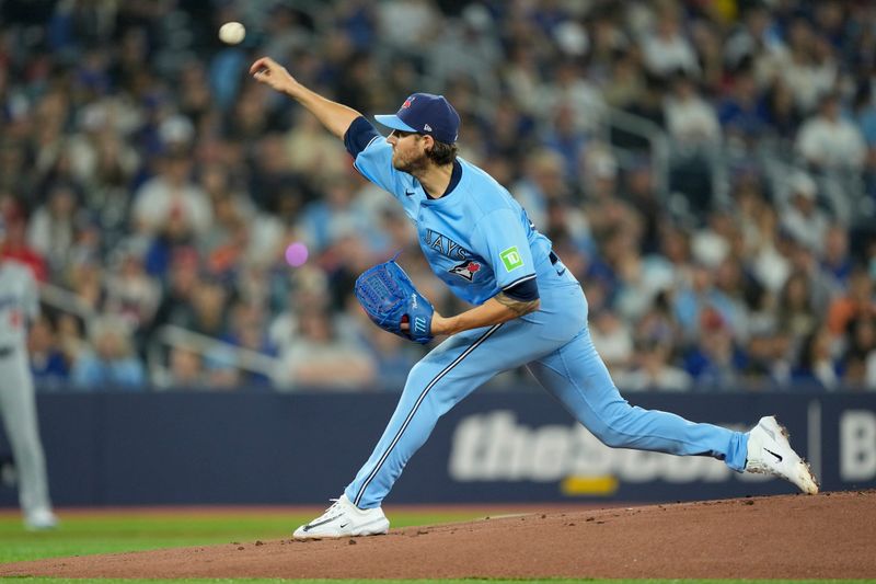 Apr 28, 2024; Toronto, Ontario, CAN; Toronto Blue Jays left fielder Davis Schneider (36) pitches to the Los Angeles Dodgers during the first inning at Rogers Centre. Mandatory Credit: John E. Sokolowski-USA TODAY Sports