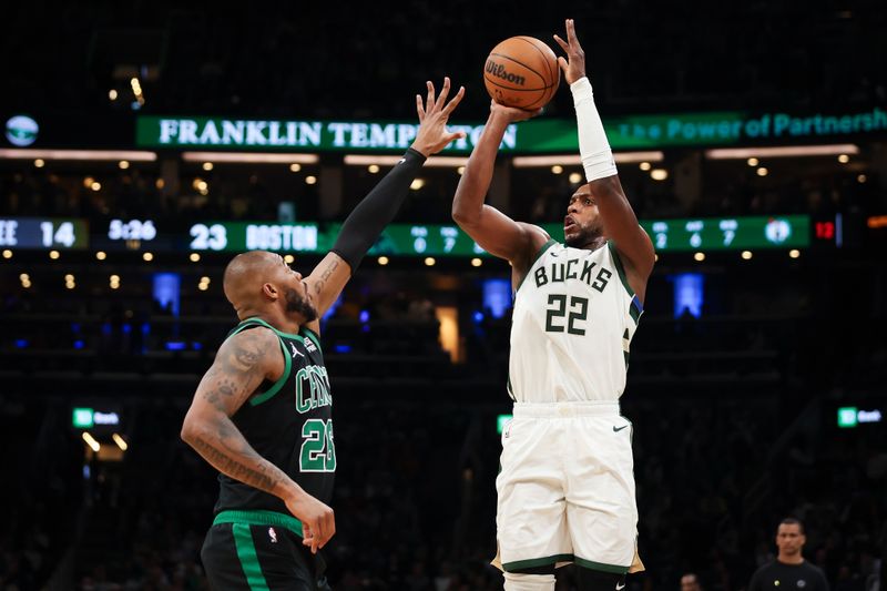 BOSTON, MA - MARCH 20: Khris Middleton #22 of the Milwaukee Bucks shoots over Xavier Tillman #26 of the Boston Celtics in the first half at TD Garden on March 20, 2024 in Boston, Massachusetts. NOTE TO USER: User expressly acknowledges and agrees that, by downloading and or using this photograph, User is consenting to the terms and conditions of the Getty Images License Agreement. (Photo by Adam Glanzman/Getty Images)