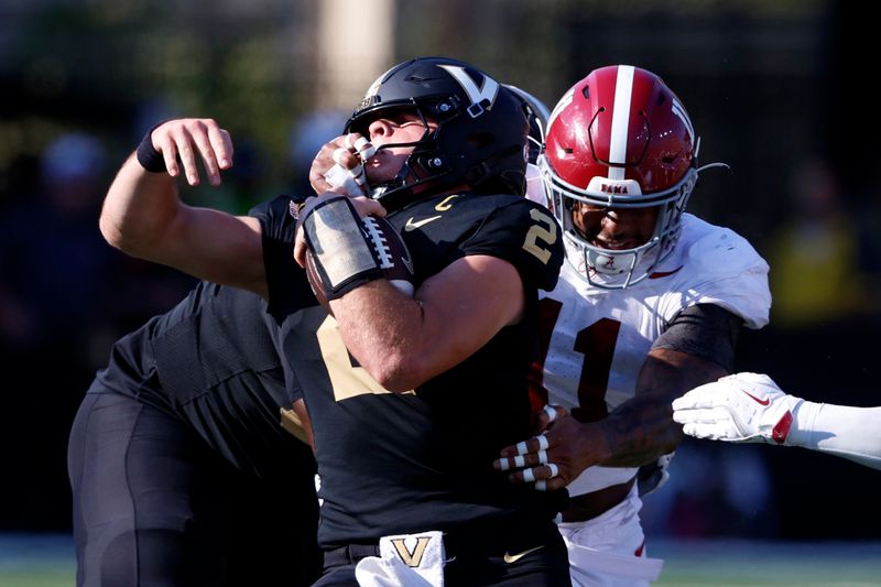 Oct 5, 2024; Nashville, Tennessee, USA;  Alabama Crimson Tide linebacker Jihaad Campbell (11) grabs the face mask of Vanderbilt Commodores quarterback Diego Pavia (2) as he tackles him during the first half at FirstBank Stadium. Mandatory Credit: Butch Dill-Imagn Images