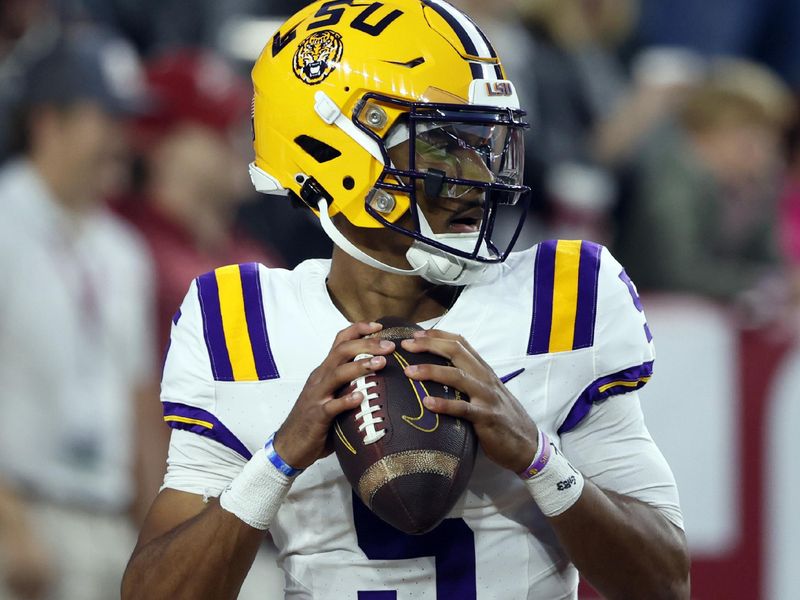 Nov 4, 2023; Tuscaloosa, Alabama, USA; LSU Tigers quarterback Jayden Daniels (5) warms up before the first half at Bryant-Denny Stadium. Mandatory Credit: Butch Dill-USA TODAY Sports