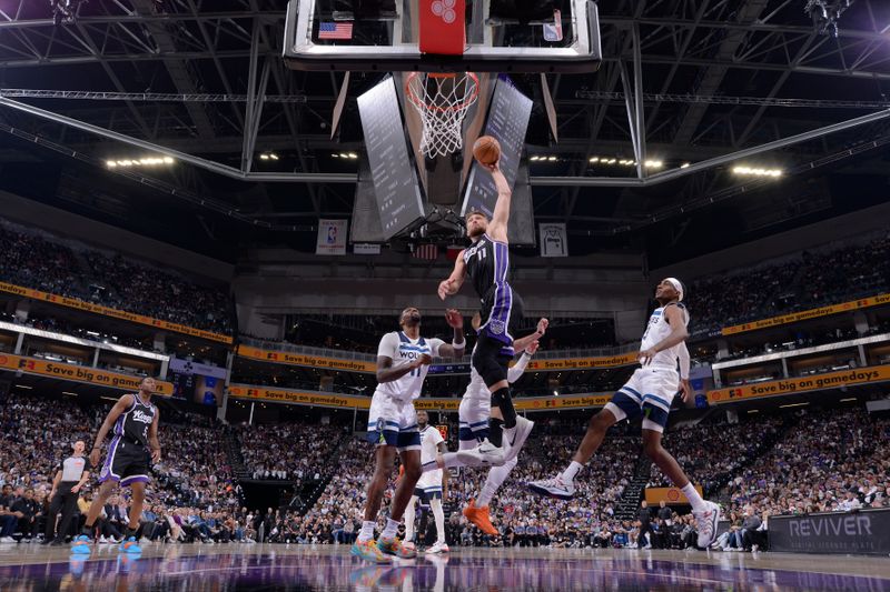 SACRAMENTO, CA - OCTOBER 24: Domantas Sabonis #11 of the Sacramento Kings dunks the ball during the game against the Minnesota Timberwolves on October 24, 2024 at Golden 1 Center in Sacramento, California. NOTE TO USER: User expressly acknowledges and agrees that, by downloading and or using this Photograph, user is consenting to the terms and conditions of the Getty Images License Agreement. Mandatory Copyright Notice: Copyright 2024 NBAE (Photo by Rocky Widner/NBAE via Getty Images)