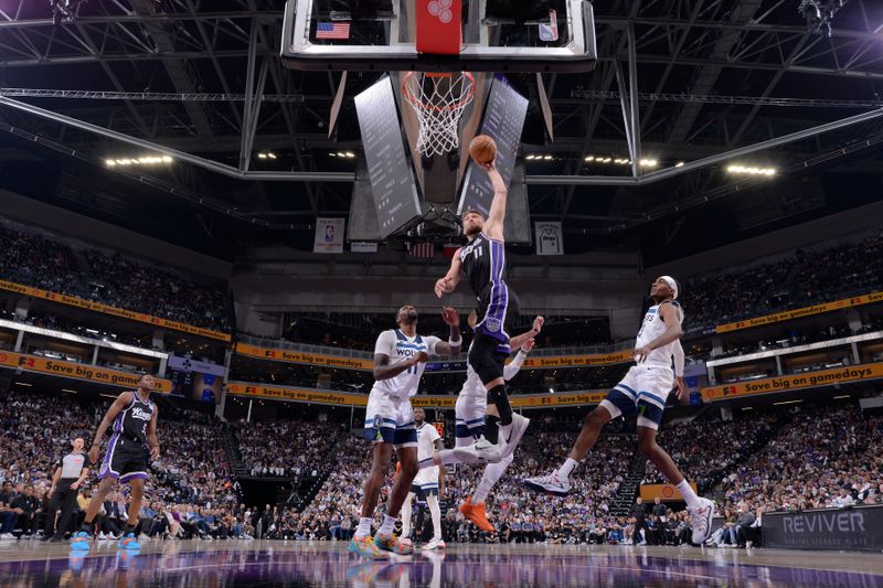 SACRAMENTO, CA - OCTOBER 24: Domantas Sabonis #11 of the Sacramento Kings dunks the ball during the game against the Minnesota Timberwolves on October 24, 2024 at Golden 1 Center in Sacramento, California. NOTE TO USER: User expressly acknowledges and agrees that, by downloading and or using this Photograph, user is consenting to the terms and conditions of the Getty Images License Agreement. Mandatory Copyright Notice: Copyright 2024 NBAE (Photo by Rocky Widner/NBAE via Getty Images)