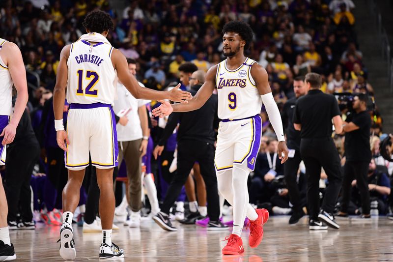 LOS ANGELES, CA - OCTOBER 6: Bronny James #9 and Max Christie #12 of the Los Angeles Lakers high five during the game against the Phoenix Suns on October 6, 2024 at Acrisure Arena in Palm Springs, California. NOTE TO USER: User expressly acknowledges and agrees that, by downloading and/or using this Photograph, user is consenting to the terms and conditions of the Getty Images License Agreement. Mandatory Copyright Notice: Copyright 2024 NBAE (Photo by Adam Pantozzi/NBAE via Getty Images)