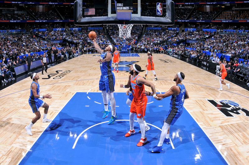 ORLANDO, FL - FEBRUARY 13: Wendell Carter Jr. #34 of the Orlando Magic grabs a rebound during the game against the Oklahoma City Thunder on February 13, 2024 at the Kia Center in Orlando, Florida. NOTE TO USER: User expressly acknowledges and agrees that, by downloading and or using this photograph, User is consenting to the terms and conditions of the Getty Images License Agreement. Mandatory Copyright Notice: Copyright 2024 NBAE (Photo by Fernando Medina/NBAE via Getty Images)