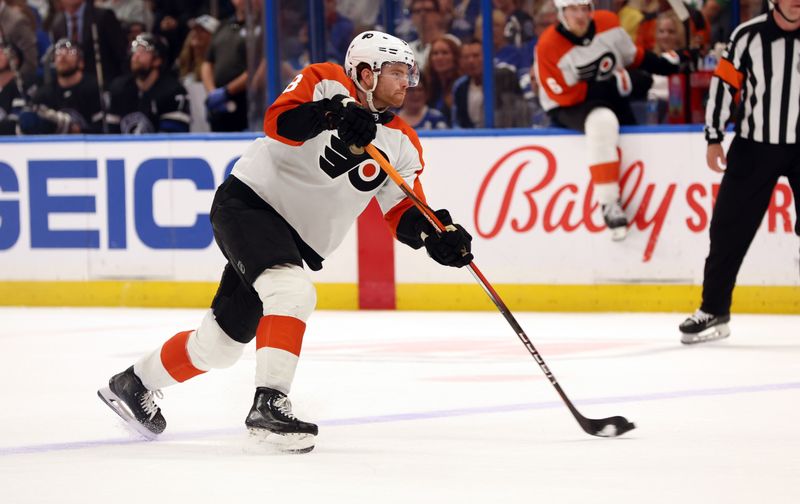 Mar 9, 2024; Tampa, Florida, USA; Philadelphia Flyers defenseman Cam York (8) passes the puck against the Tampa Bay Lightning during the second period at Amalie Arena. Mandatory Credit: Kim Klement Neitzel-USA TODAY Sports