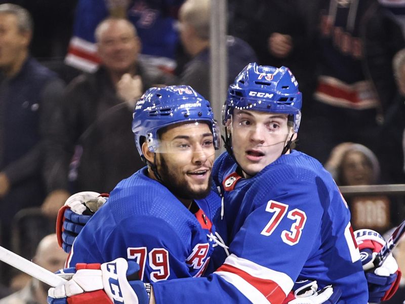 Apr 21, 2024; New York, New York, USA; New York Rangers center Matt Rempe (73) celebrates with defenseman K'Andre Miller (79) after scoring a goal in the second period against the Washington Capitals in game one of the first round of the 2024 Stanley Cup Playoffs at Madison Square Garden. Mandatory Credit: Wendell Cruz-USA TODAY Sports