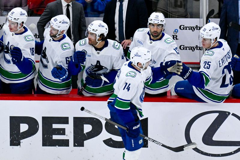 Oct 17, 2025; Chicago, Illinois, USA;  Vancouver Canucks left wing Jake Debrusk (74) celebrates with teammates after he scores against the Chicago Blackhawks during the second period at the United Center. Mandatory Credit: Matt Marton-Imagn Images