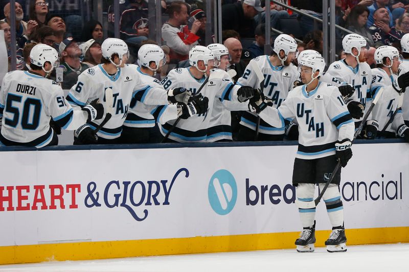 Mar 7, 2026; Columbus, Ohio, USA; Utah Mammoth right wing Dylan Guenther (11) celebrates his goal against the Columbus Blue Jackets during the second period at Nationwide Arena. Mandatory Credit: Russell LaBounty-Imagn Images
