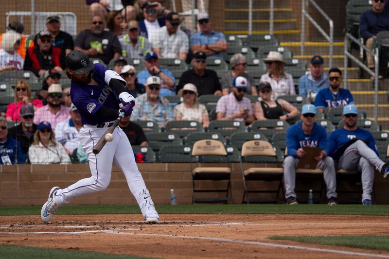 Mar 6, 2024; Salt River Pima-Maricopa, Arizona, USA; Colorado Rockies infielder Brendan Rodgers (7) at bat in the first during a spring training game against  the Texas Rangers at Salt River Fields at Talking Stick. Mandatory Credit: Allan Henry-USA TODAY Sports