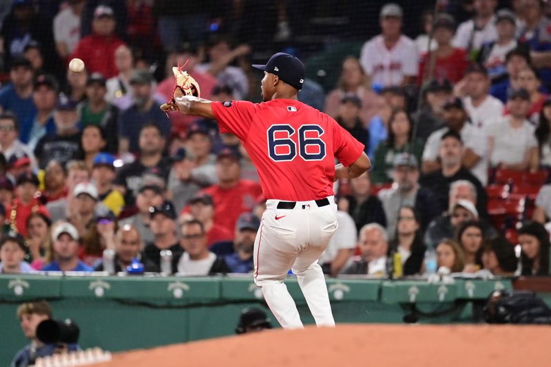 Jun 14, 2024; Boston, Massachusetts, USA;  Boston Red Sox starting pitcher Brayan Bello (66) can't handle the ball at first base against the New York Yankees during the fourth inning at Fenway Park. Mandatory Credit: Eric Canha-USA TODAY Sports