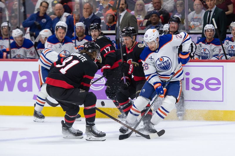 Nov 19, 2024; Ottawa, Ontario, CAN; Ottawa Senators right wing Adam gaudette (81) battles with Edmonton Oilers right wing Connor Brown (28) for control of the puck in the second period at the Canadian Tire Centre. Mandatory Credit: Marc DesRosiers-Imagn Images