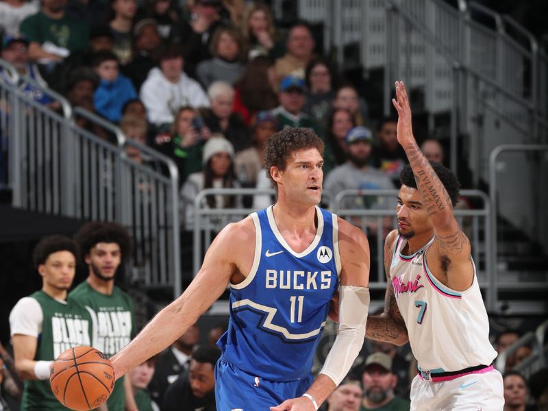 MILWAUKEE, WI - FEBRUARY 23:  Brook Lopez #11 of the Milwaukee Bucks handles the ball during the game against the Miami Heat on February 23, 2025 at Fiserv Forum Center in Milwaukee, Wisconsin. NOTE TO USER: User expressly acknowledges and agrees that, by downloading and or using this Photograph, user is consenting to the terms and conditions of the Getty Images License Agreement. Mandatory Copyright Notice: Copyright 2025 NBAE (Photo by Gary Dineen/NBAE via Getty Images).