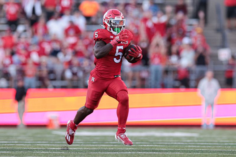 Sep 16, 2023; Piscataway, New Jersey, USA; Rutgers Scarlet Knights running back Kyle Monangai (5) scores on a rushing touchdown during the second half against the Virginia Tech Hokies at SHI Stadium. Mandatory Credit: Vincent Carchietta-USA TODAY Sports